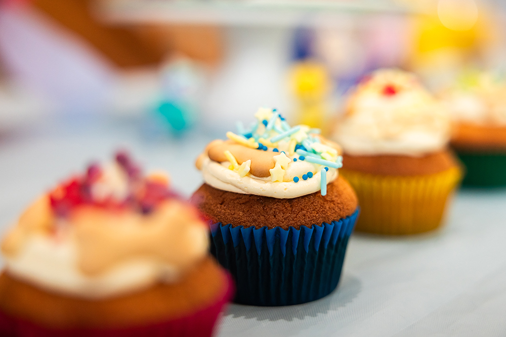 Pup themed cupcakes with doggy bone biscuits